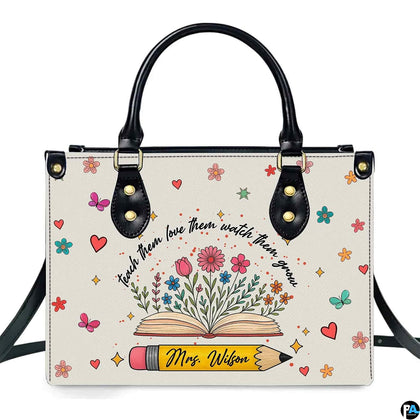 Botanical floral book teacher handbag featuring open book blooming with wildflowers and yellow pencil.