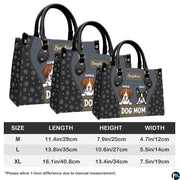 Full set presentation of slate grey dog handbag and matching wallet displayed on neutral background.