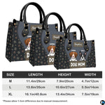 Full set presentation of slate grey dog handbag and matching wallet displayed on neutral background.