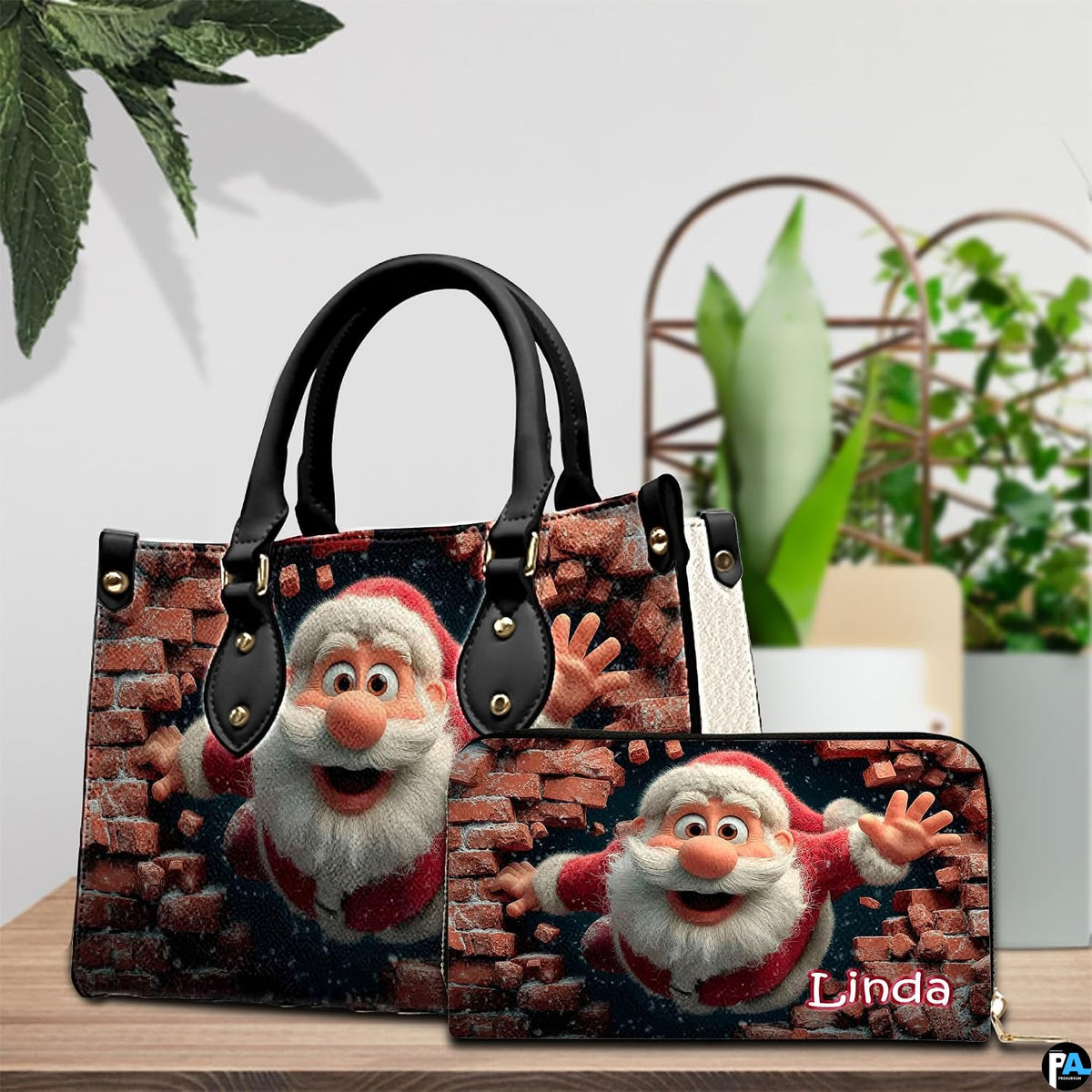 Handbag and coordinated wallet set displayed on wooden tabletop beside green houseplant.