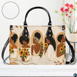Frontal presentation displaying five women sunflower portraits on light wooden surface beside blooms.