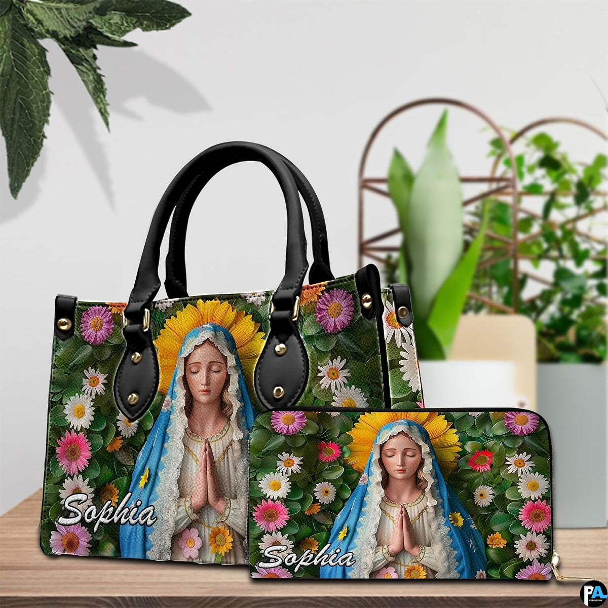Virgin Mary floral handbag and coordinated wallet set displayed on wooden surface