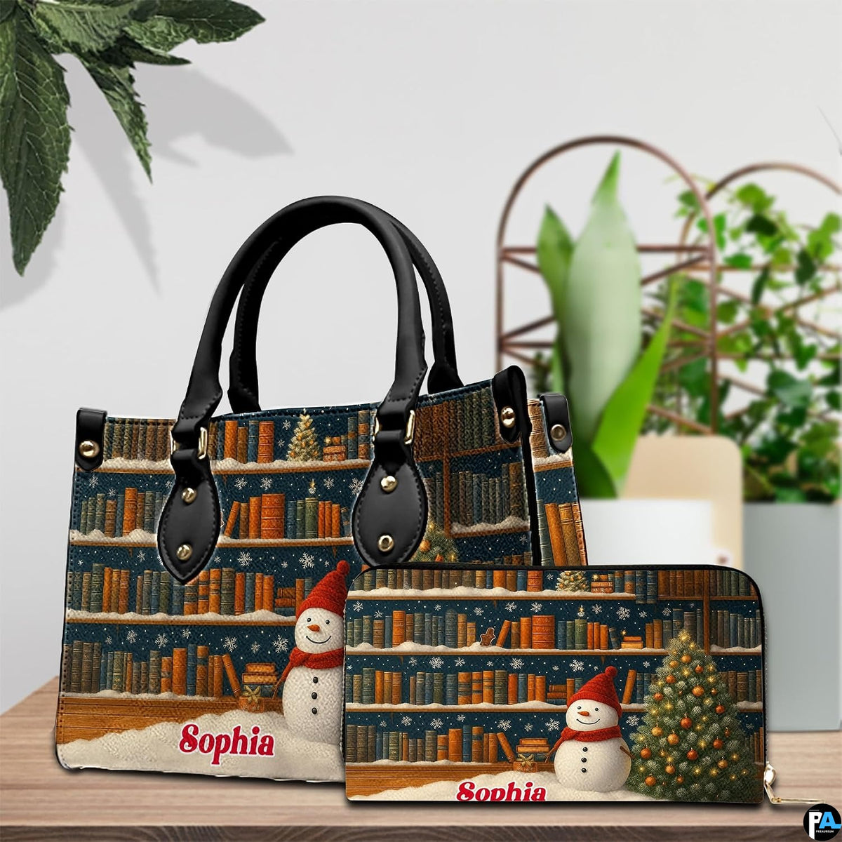 Matching holiday bookshelf handbag and zip-around wallet set displayed on wooden table