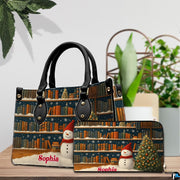 Matching holiday bookshelf handbag and zip-around wallet set displayed on wooden table