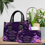 Detailed angle view of illuminated purple cross emblem and surrounding floral blossoms on handbag.