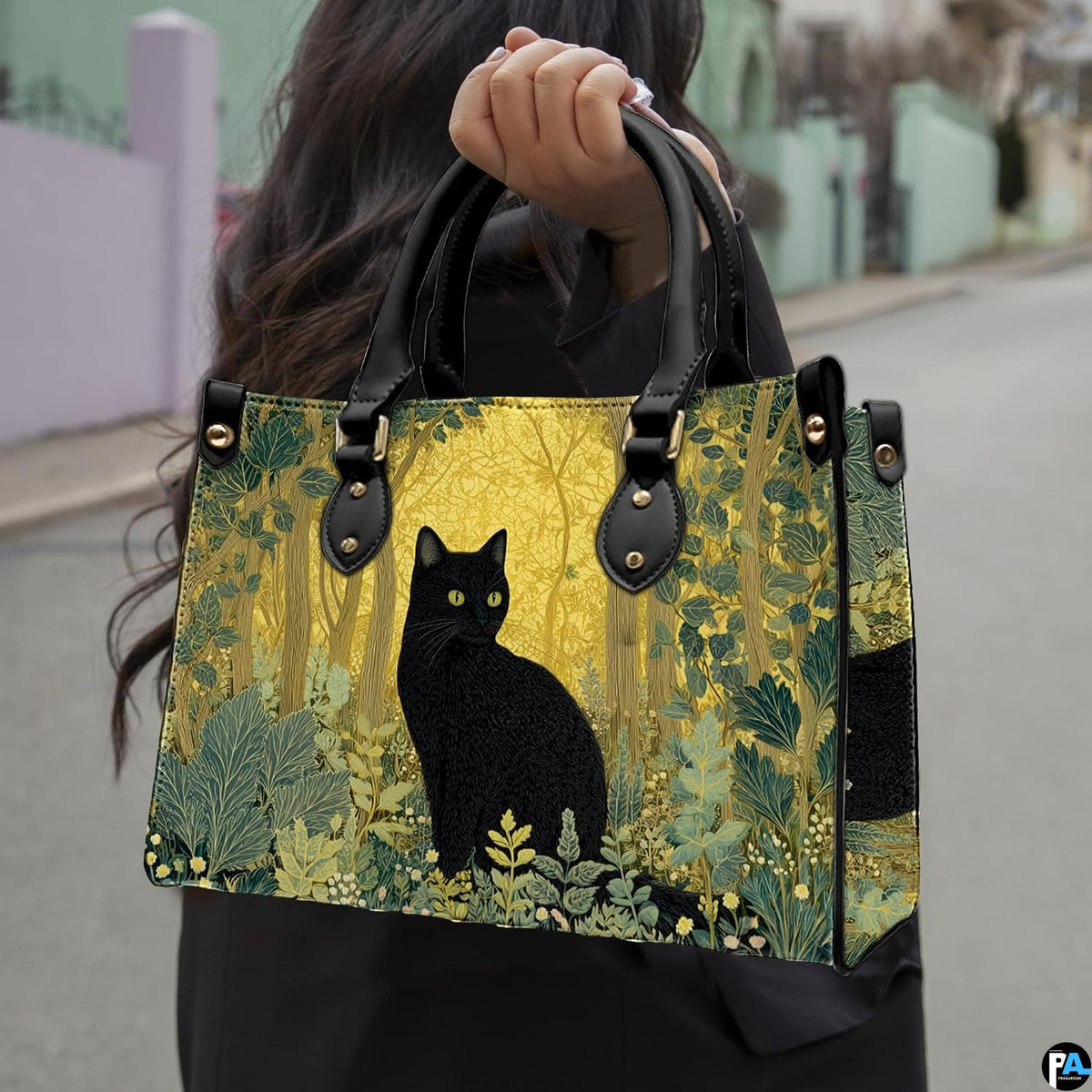 Golden forest black cat artwork held outdoors along an open neighborhood pathway.