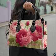 Street lifestyle perspective featuring vintage rose art accessory held outdoors in natural daylight.