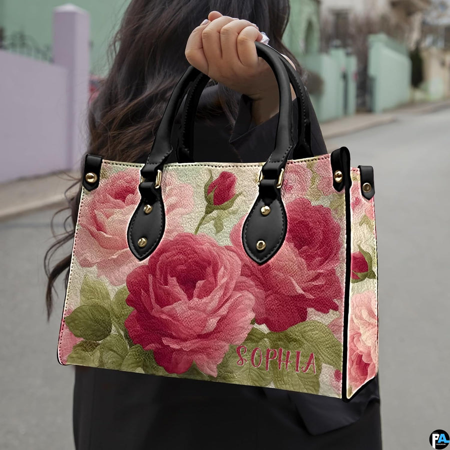 Street lifestyle perspective featuring vintage rose art accessory held outdoors in natural daylight.