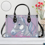Side perspective of crowned unicorn handbag displaying structured shape