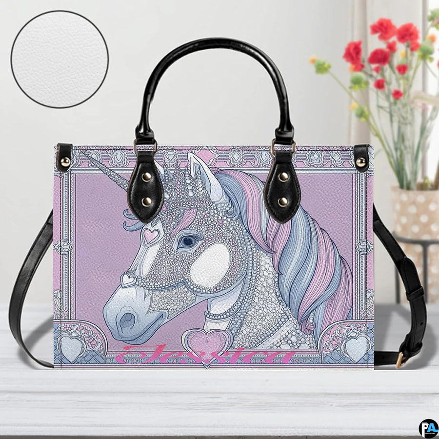 Side perspective of crowned unicorn handbag displaying structured shape