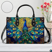 Front view of peacock stained glass pattern handbag with shoulder strap