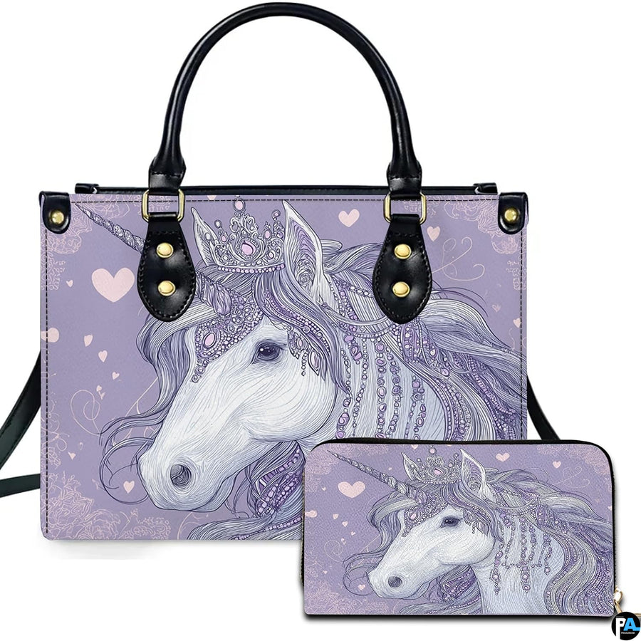 Front view of regal crowned unicorn handbag and matching wallet set on lavender background with hearts.