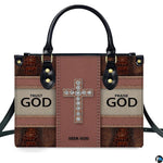 Side profile view of structured faith crystal cross handbag.