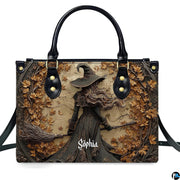 Gothic autumn witch broomstick handbag shown alone on white background.