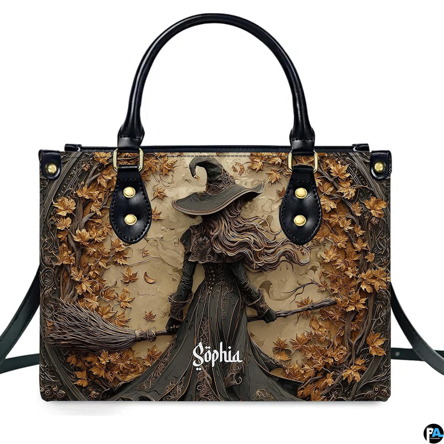 Gothic autumn witch broomstick handbag shown alone on white background.