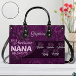 Coordinated arrangement of handbag and wallet displaying matching purple floral print.