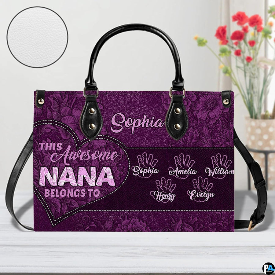 Coordinated arrangement of handbag and wallet displaying matching purple floral print.