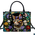 Front studio shot of stained glass cat portrait and floral medallion.