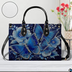 Perspective angle view of butterfly handbag highlighting side depth and seamless pattern alignment.