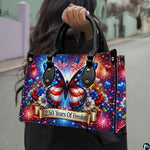Model holding patriotic butterfly fireworks handbag outdoors