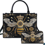 Front view of baroque queen bee handbag and matching wallet set with golden sunburst medallions.