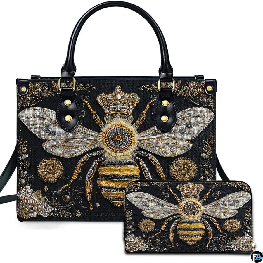Front view of baroque queen bee handbag and matching wallet set with golden sunburst medallions.
