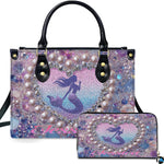 Front view of mermaid heart handbag and matching wallet set with pastel ocean glitter artwork.