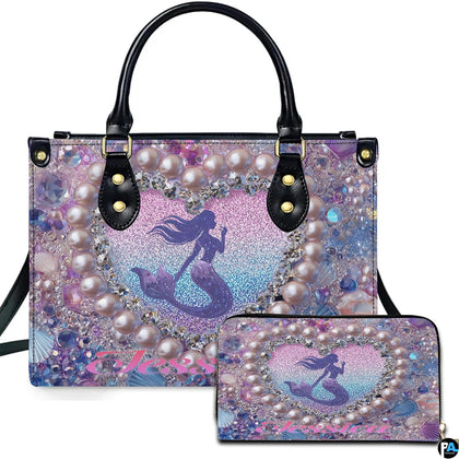 Front view of mermaid heart handbag and matching wallet set with pastel ocean glitter artwork.