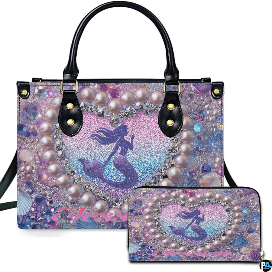 Front view of mermaid heart handbag and matching wallet set with pastel ocean glitter artwork.