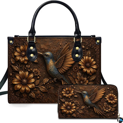 Front view of bronze hummingbird handbag and matching wallet featuring embossed floral daisies and scrollwork.