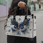 Angled view of matching porcelain butterfly set showcasing embossed ceramic vine relief details
