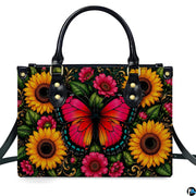 Direct front studio view showcasing the pink monarch butterfly and blooming golden sunflowers on white surface.