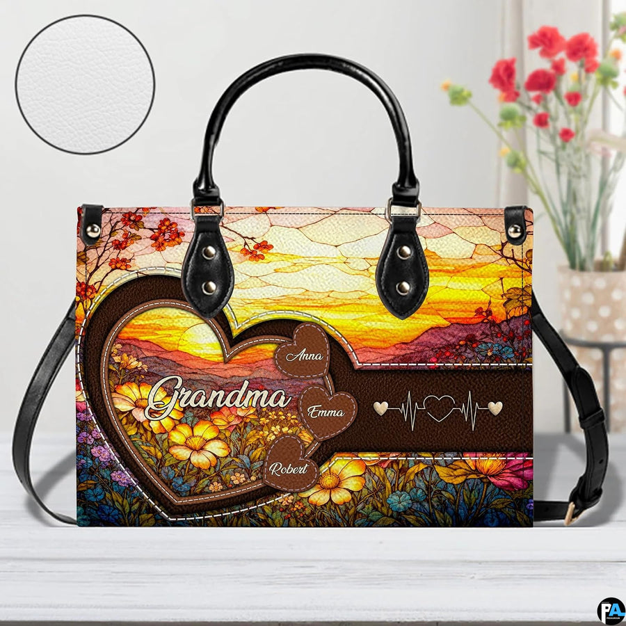 Frontal presentation of stained glass sunrise floral motif positioned on light wooden surface.