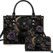 Studio presentation of gothic black cat and crescent moon artwork alongside matching companion accessory on white surface.
