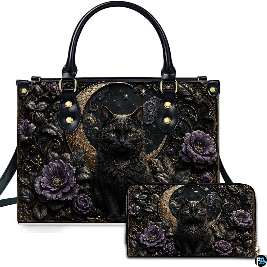 Studio presentation of gothic black cat and crescent moon artwork alongside matching companion accessory on white surface.