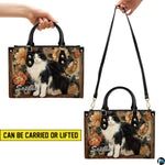 Carrying presentation showing handheld and shoulder display methods for black white cat art botanical design.