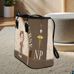 Perspective view of the Mocha Clinician Tote Handbag standing on a light carpeted surface.