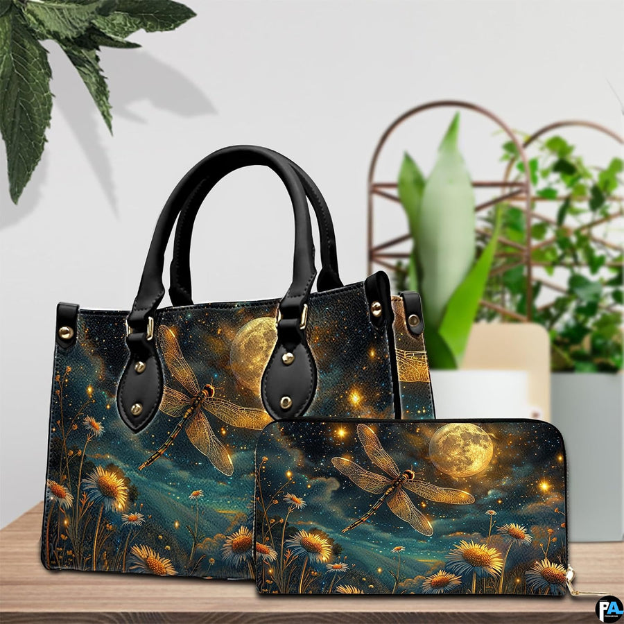 Tabletop lifestyle presentation of moonlit dragonfly handbag and matching wallet with potted plants