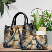 Devotional handbag and wallet set shown on tabletop beside green indoor plants