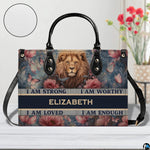 Front view of lion floral handbag on white tabletop with circular textured exterior swatch.