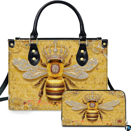 Golden honeycomb bee handbag and matching zip wallet displayed against studio background with crown details.