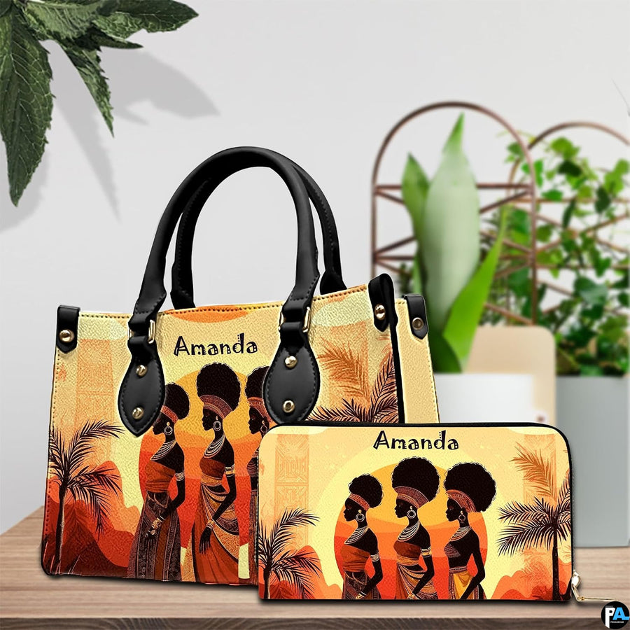 African landscape art prints design arranged on an indoor surface beside green decorative foliage.