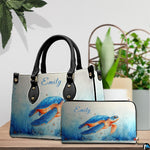 Lifestyle model display showing the watercolor turtle handbag carried over the shoulder.