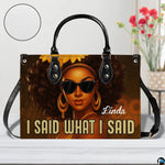 Handbag presented on light tabletop with floral decor and surface texture highlight.