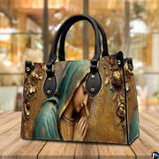 Complete matching handbag and wallet set in sculpted golden Virgin Mary arrangement