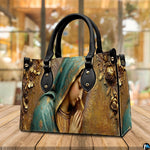Complete matching handbag and wallet set in sculpted golden Virgin Mary arrangement