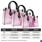 Bottom view of pink nurse handbag showing flat rectangular base