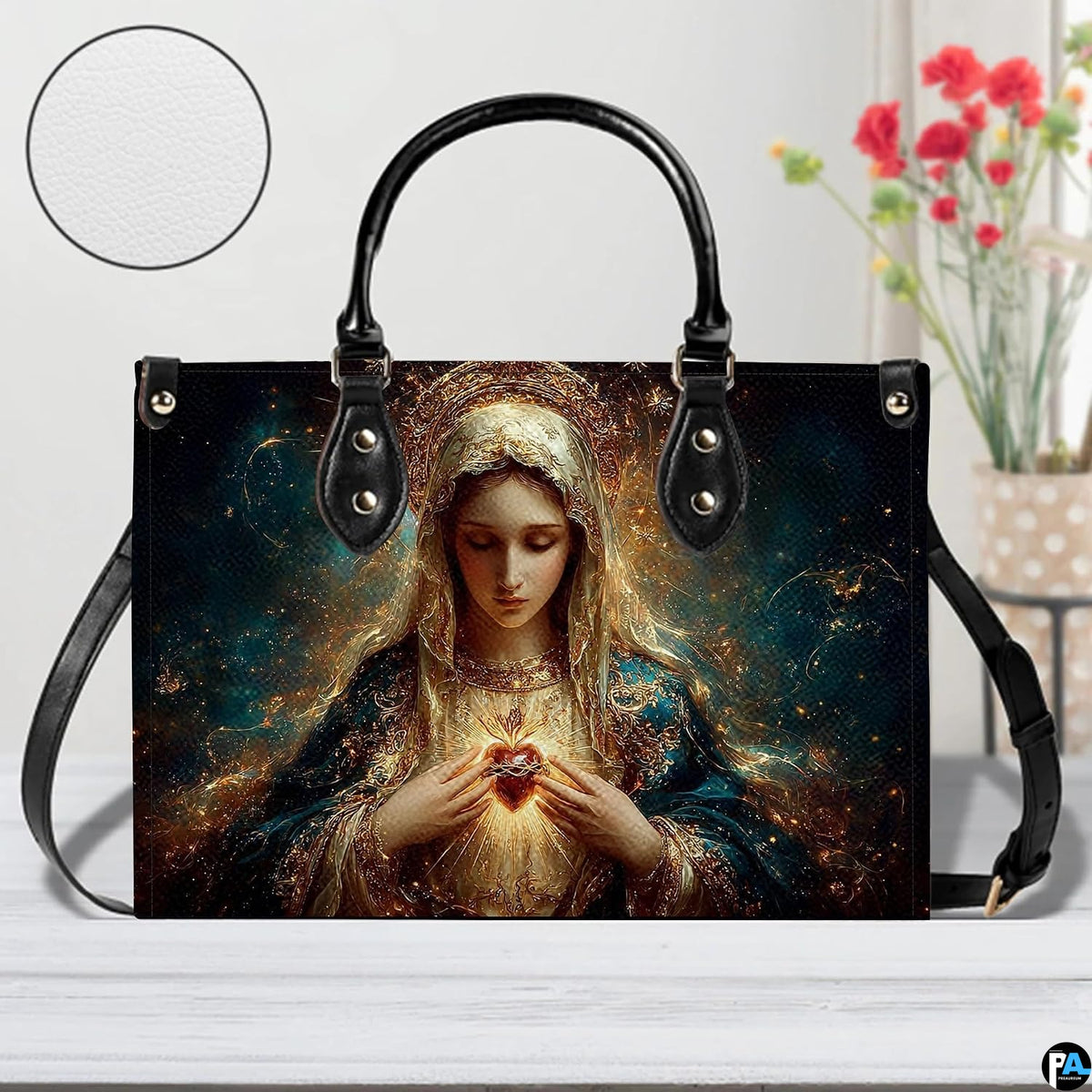 Studio display of Immaculate Heart of Mary handbag highlighting print details and texture inset.