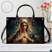 Studio display of Immaculate Heart of Mary handbag highlighting print details and texture inset.