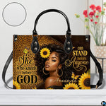 African American faith sunflower art presented on a studio surface beside vibrant floral blossoms.
